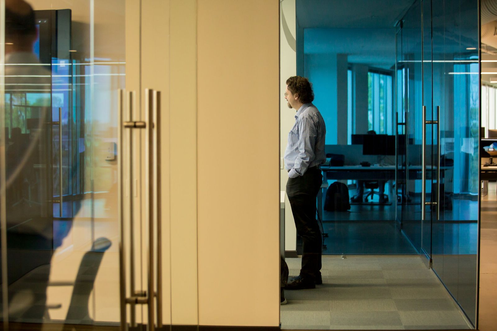 Darby Sieben in a glass-walled office
